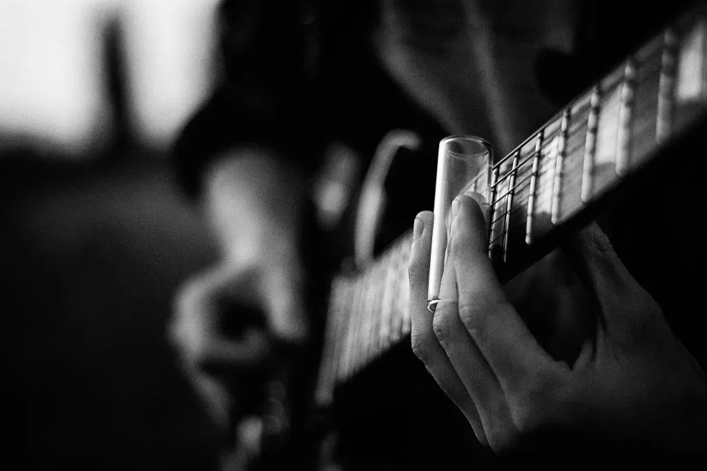 2 guitarist with glass slide