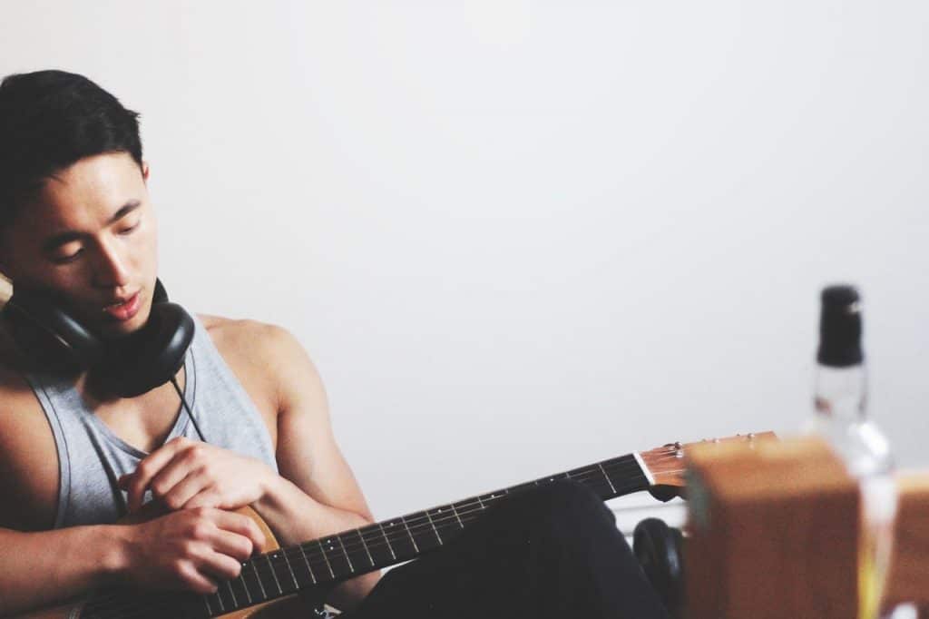 Audio-Technica AT2035 Review: A Microphone Perfect For Acoustic Guitar 2 man with guitar