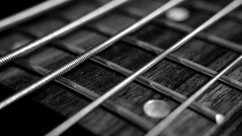 Strings on fretboard