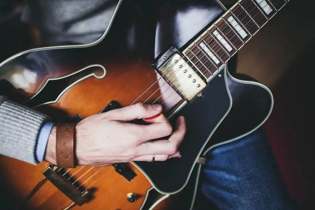 Guitarist using a pick