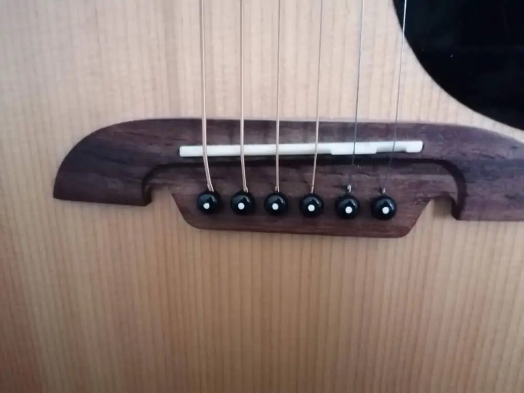 Nylon and steel store string guitar