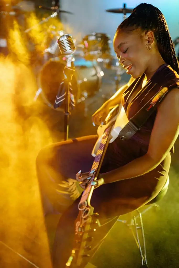 sing and play guitar standing