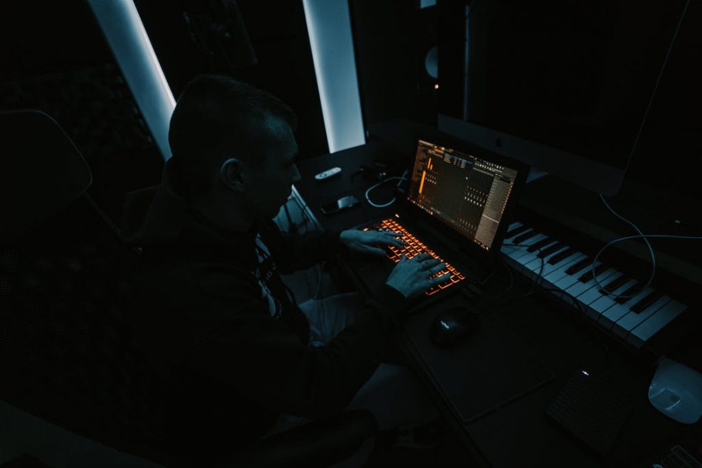 5. Guy producing music in his studio on FL Studio