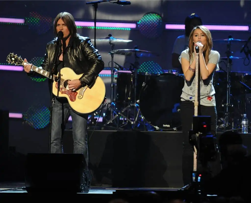 11. Miley and Billy Ray Cyrus on stage